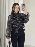Blouse à pois à col montant